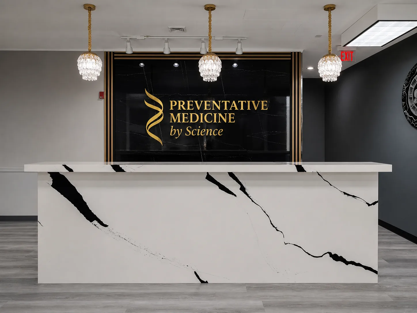 The Preventative Medicine by Science reception desk, with the practice name lettered on a dark marble wall.